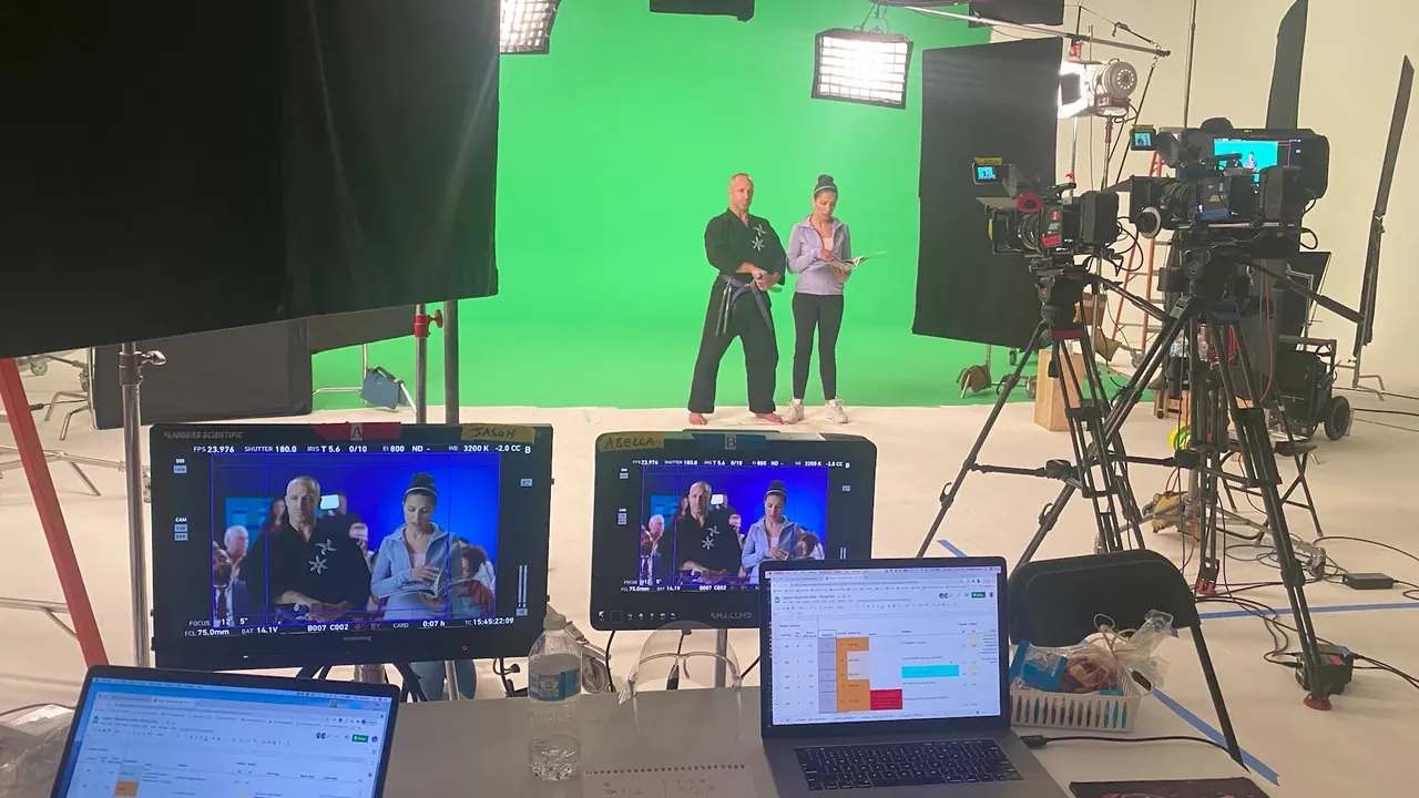 Green screen stage with talent and monitors
