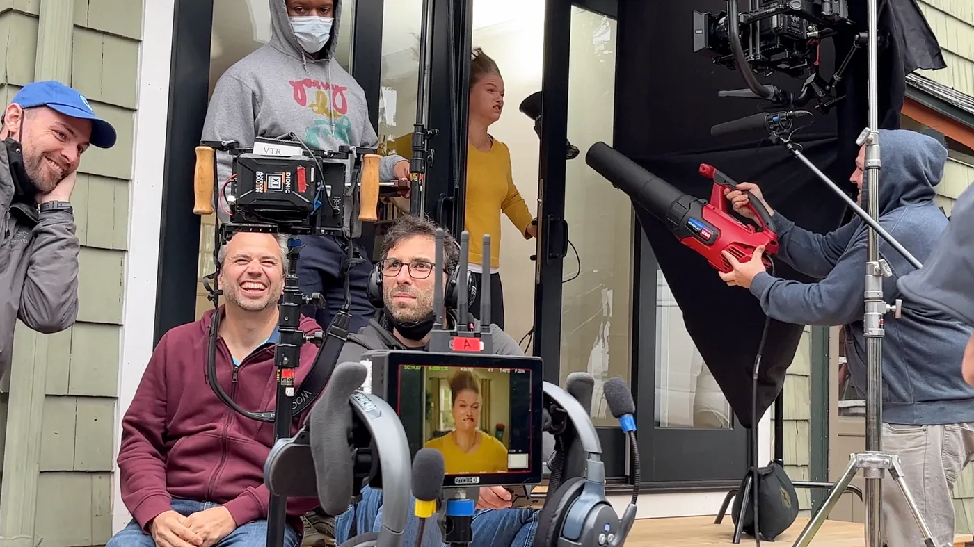 Director and crew at the monitor on a live action set